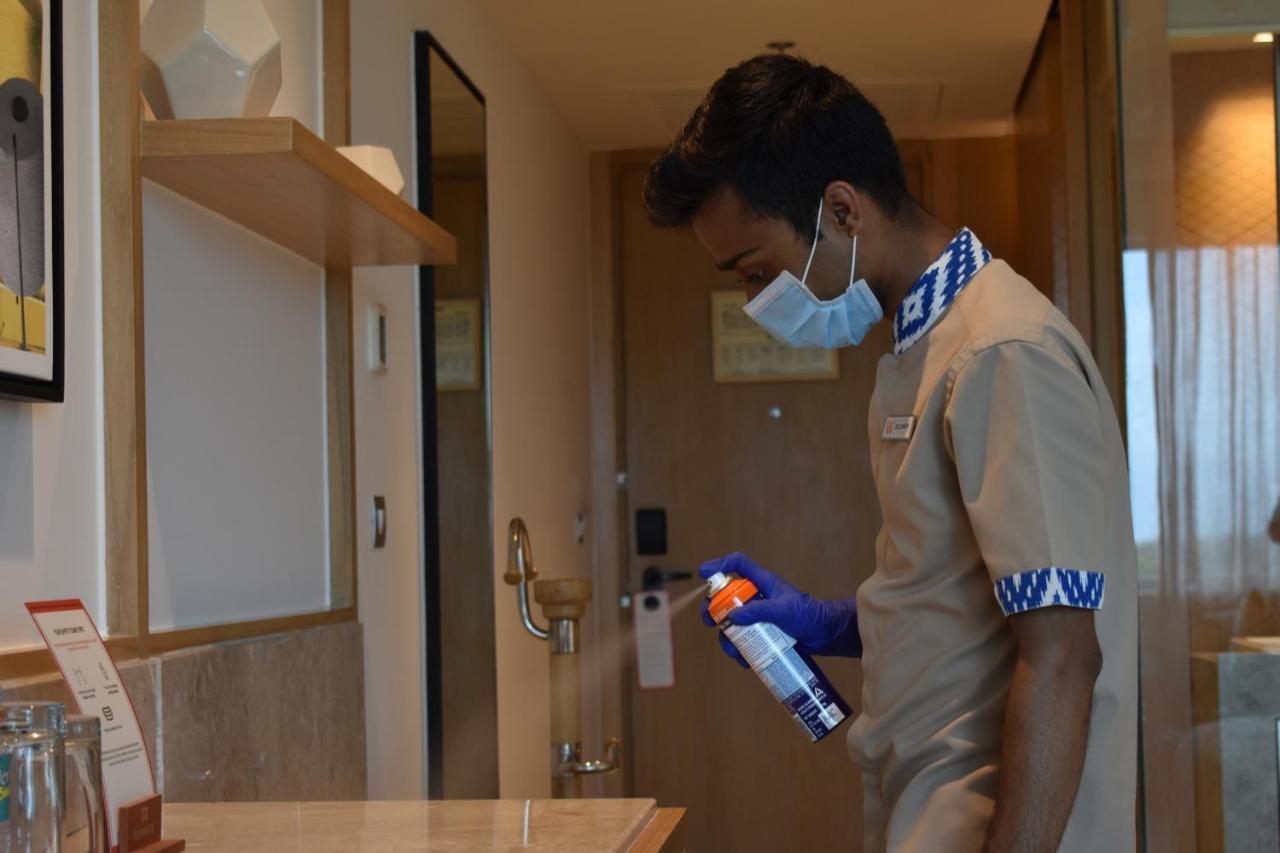 Welcomhotel By Itc Hotels, Racecourse, Коимбатур Экстерьер фото A hotel employee disinfecting a guest room